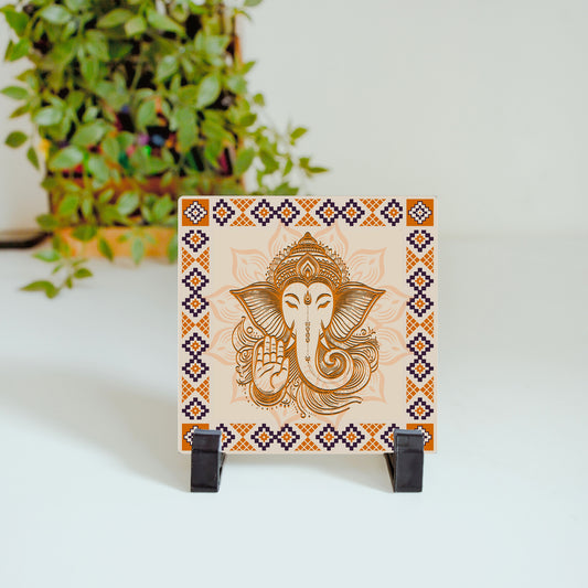 Ceramic tile featuring a warm Ganesha illustration in traditional festive tones.