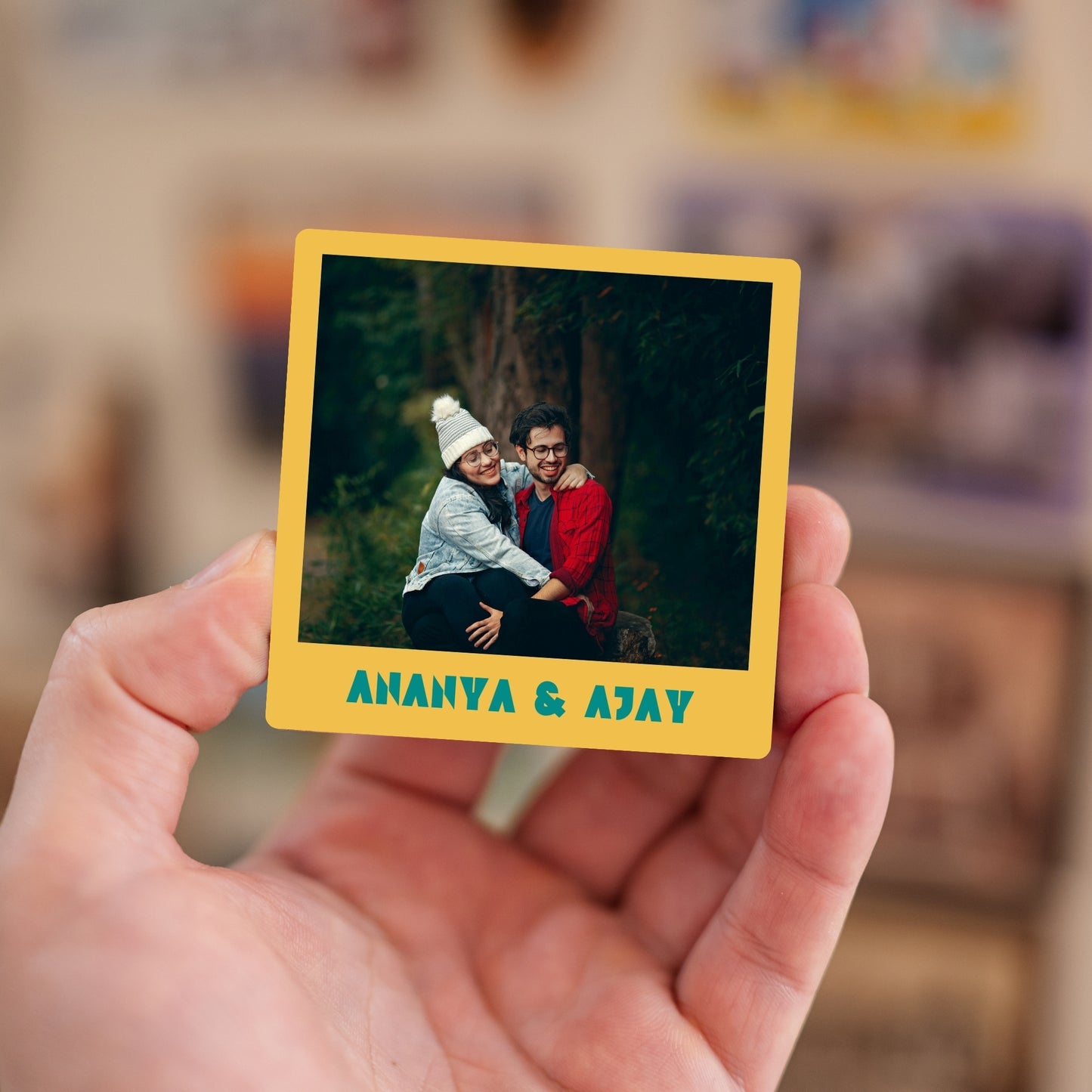Handheld custom photo magnet with names.