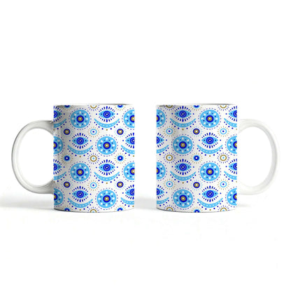 White ceramic mug featuring traditional evil eye design.