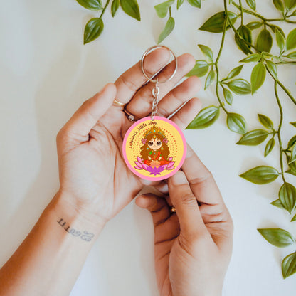 Hand holding double sided keychain