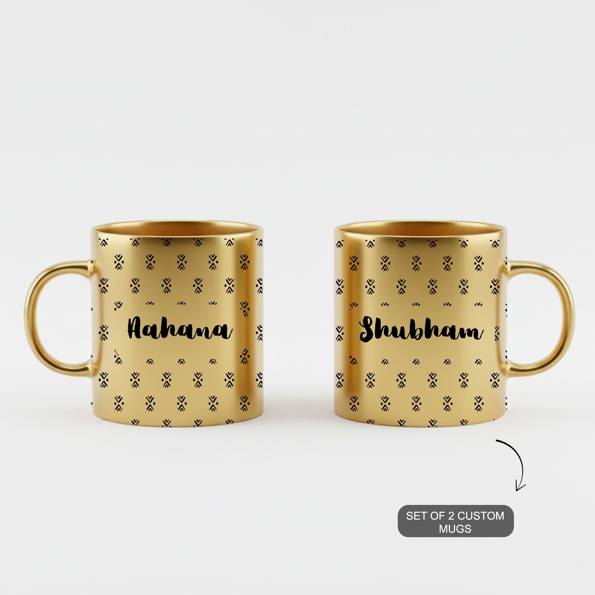 Pair of golden custom mugs with ethnic designs and personalized names.
