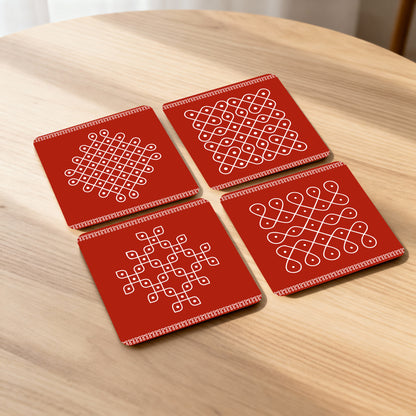 Set of 4 coasters with traditional kolam designs.
