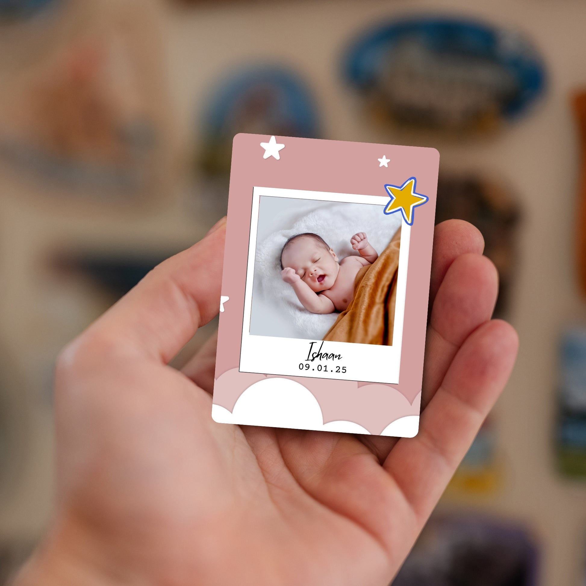 Handheld A Little Star personalized baby photo magnet with name and date.