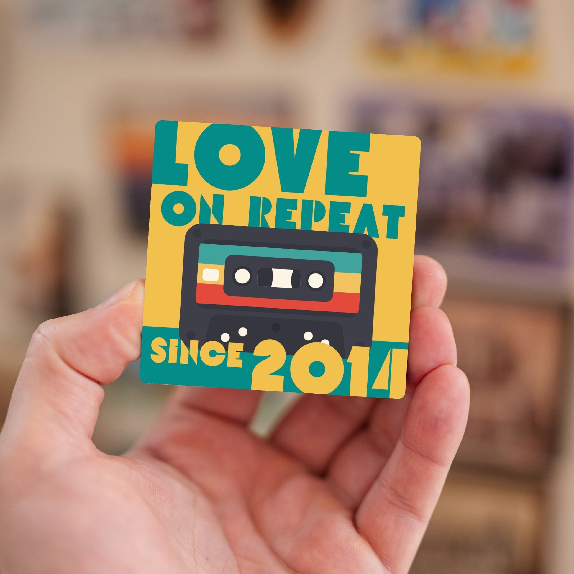 Handheld personalized Love on Repeat magnet.