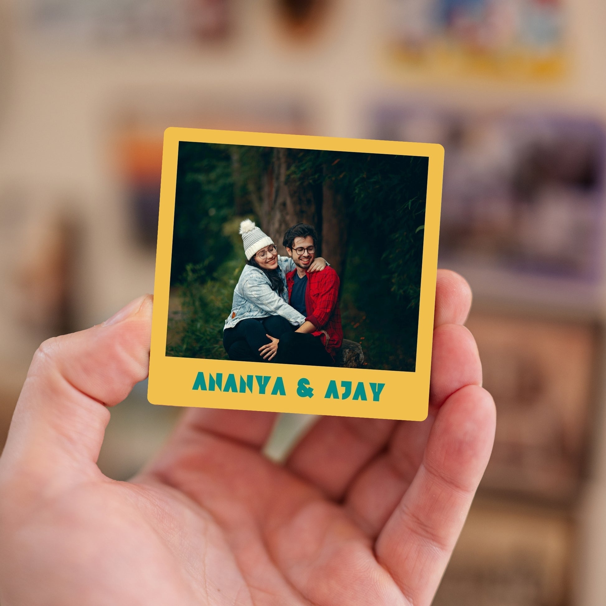 Handheld custom photo magnet with names.
