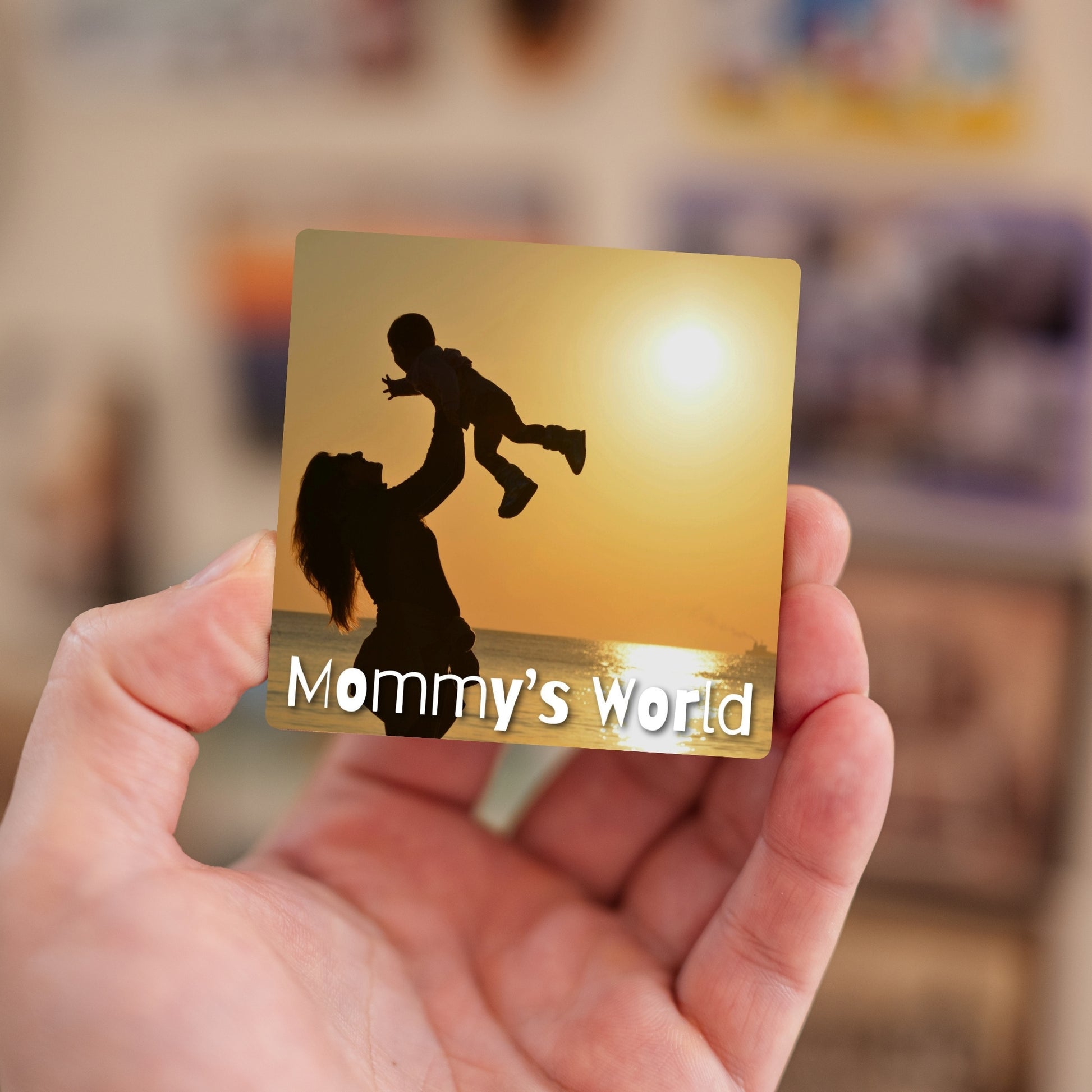 Handheld Mommy’s World personalized baby magnet.