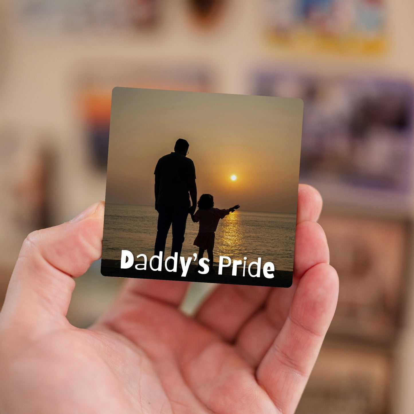 Handheld Daddy’s Pride personalized baby magnet.