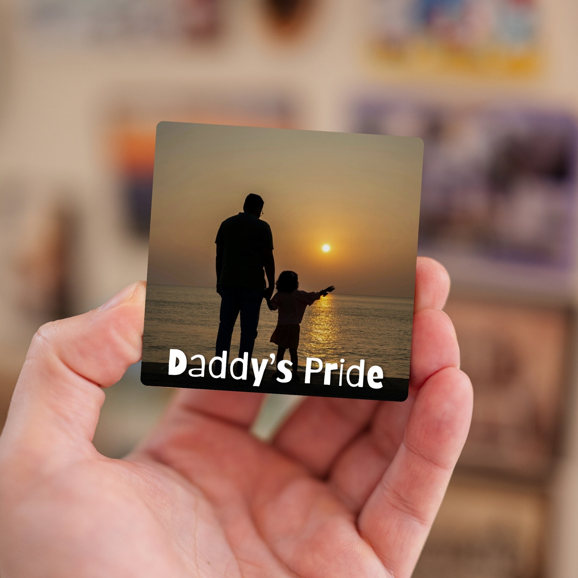 Handheld Daddy’s Pride personalized baby magnet.