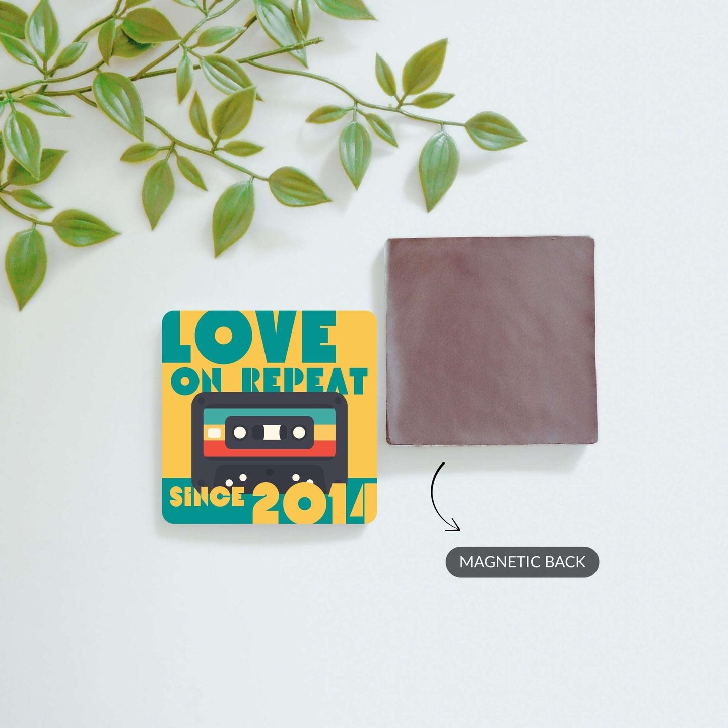Front and back view of Love on Repeat and custom photo magnets.