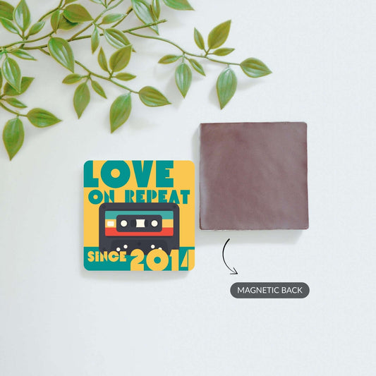 Front and back view of Love on Repeat and custom photo magnets.